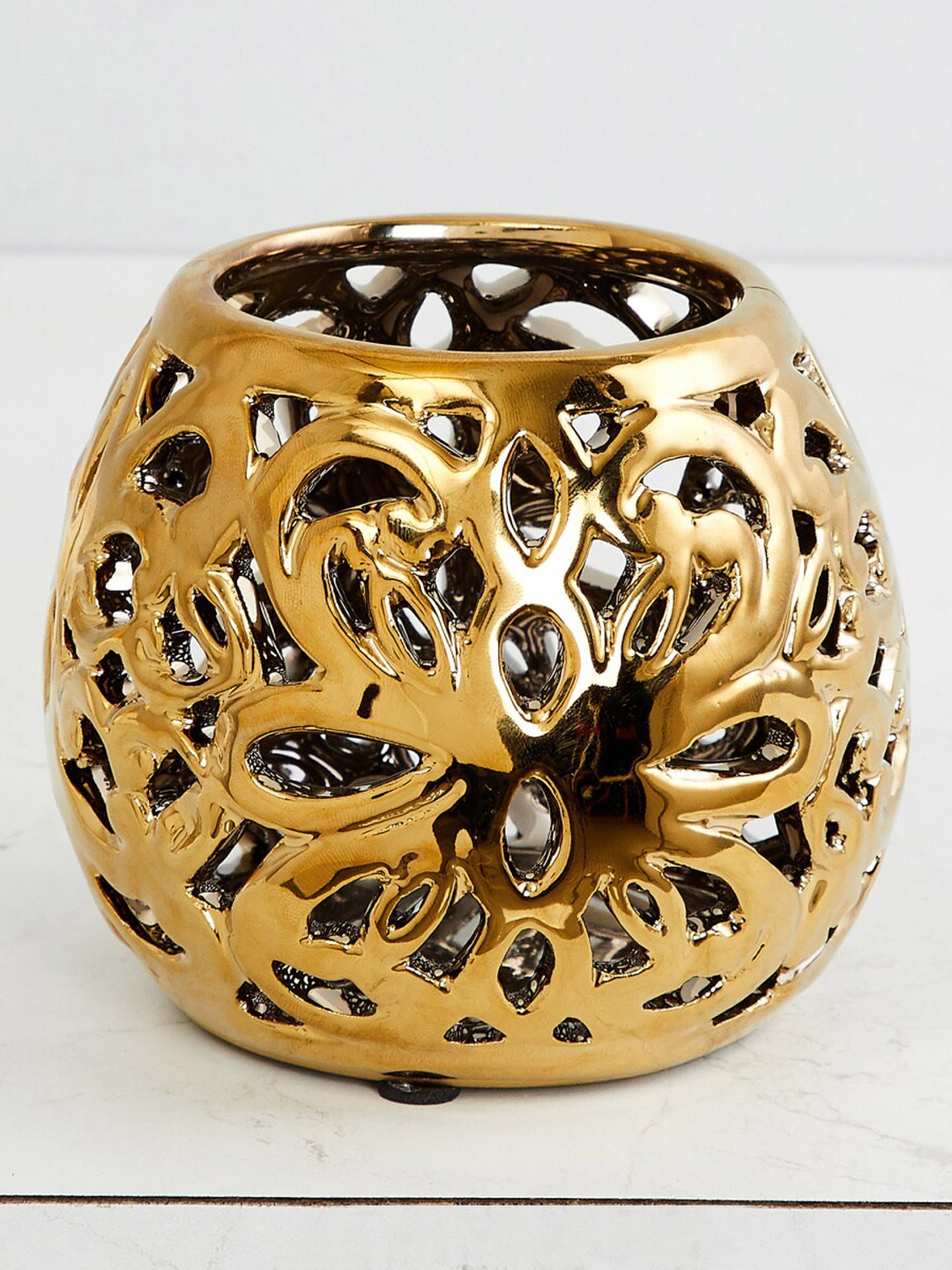 

Home Centre Gold-Toned Stellar Celestial Carved Votive Holder