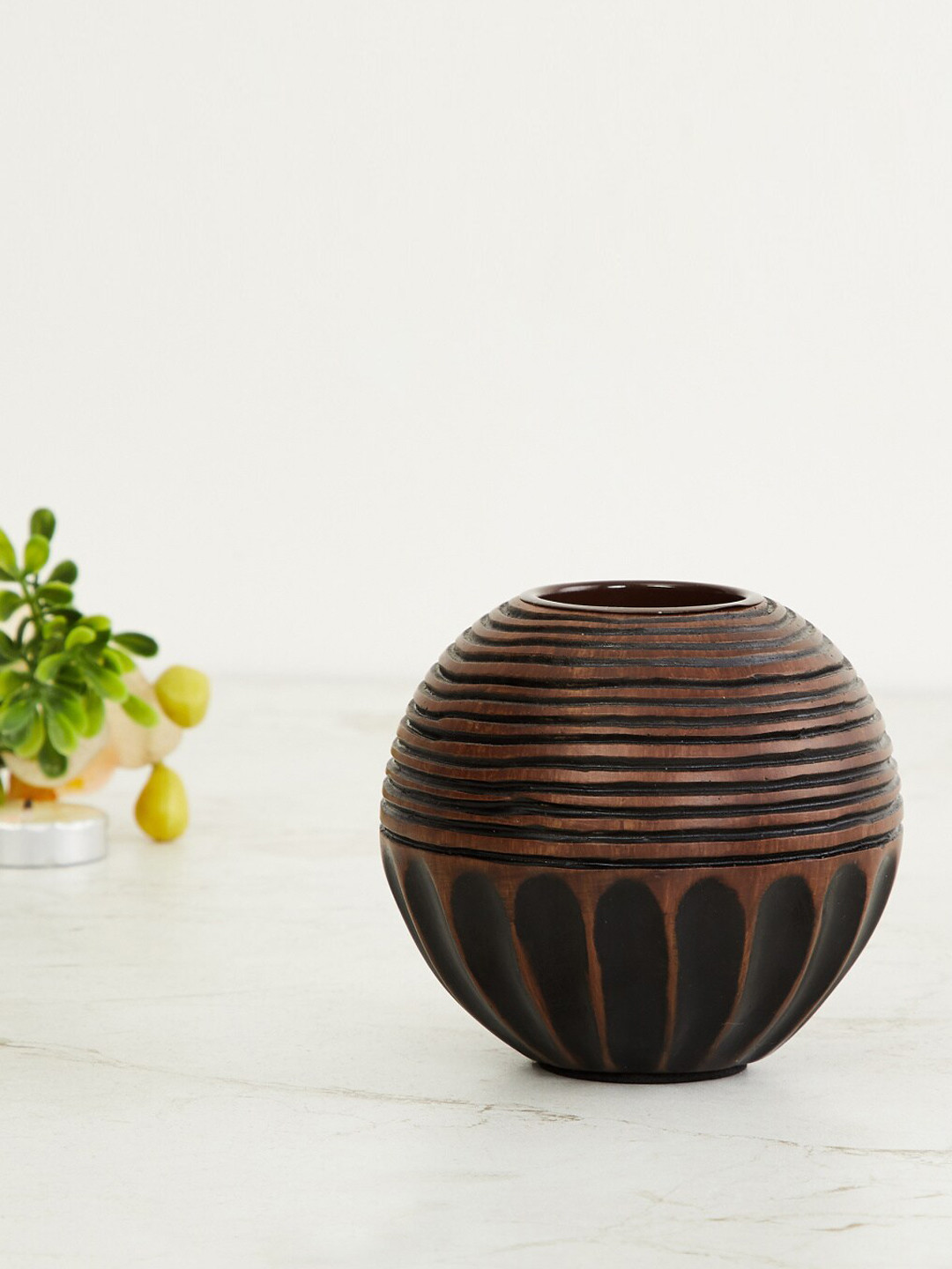 

Home Centre Brown & Black Adrian Textured T-Light Holder