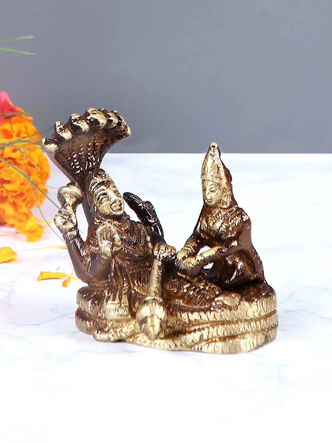 

Aapno Rajasthan Brown & Gold-Toned Brass Lord Vishnu & Goddess Laxmi Showpiece