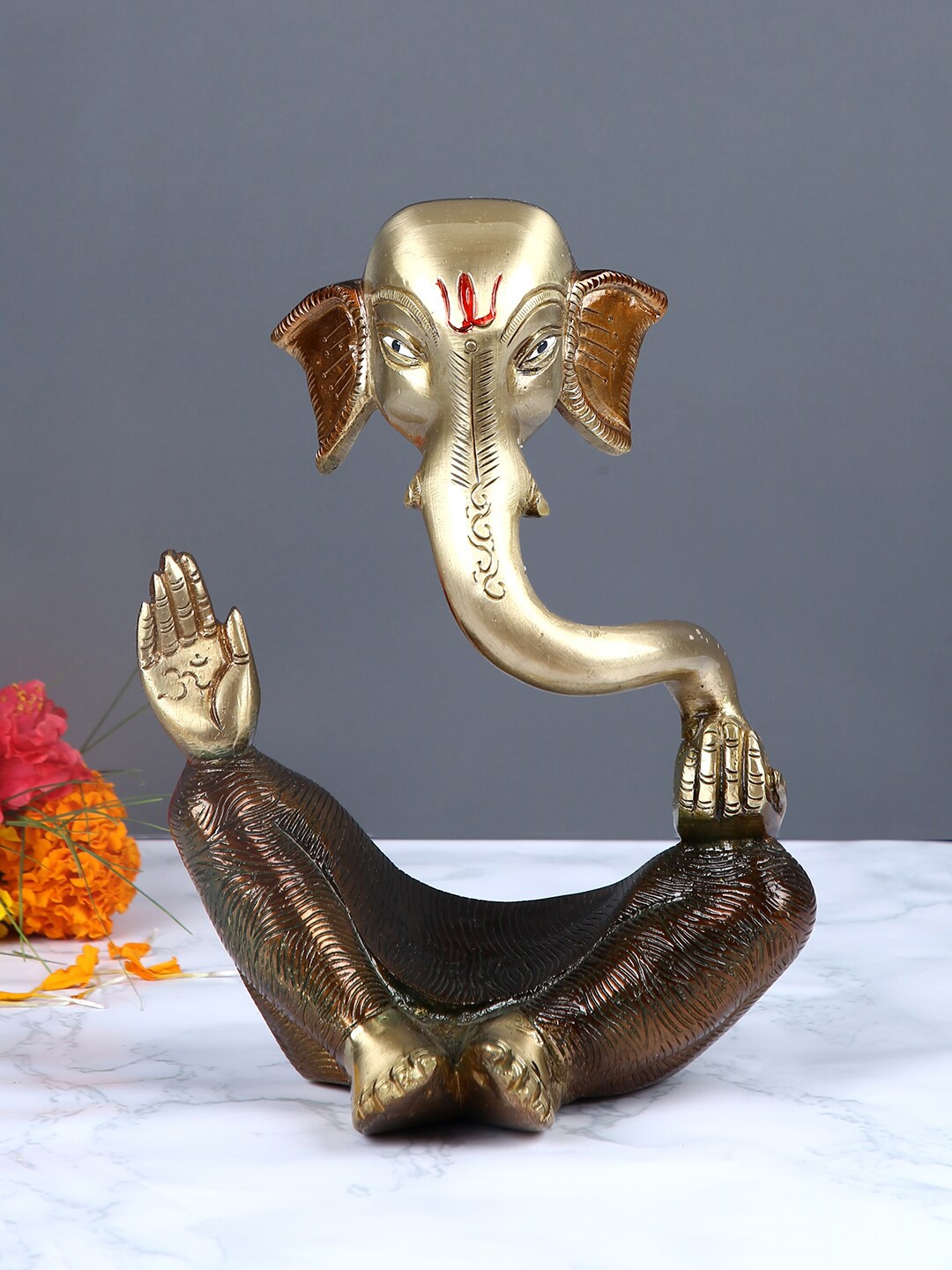 

Aapno Rajasthan Brown & Gold-Toned Handcrafted Lord Ganesha Statue