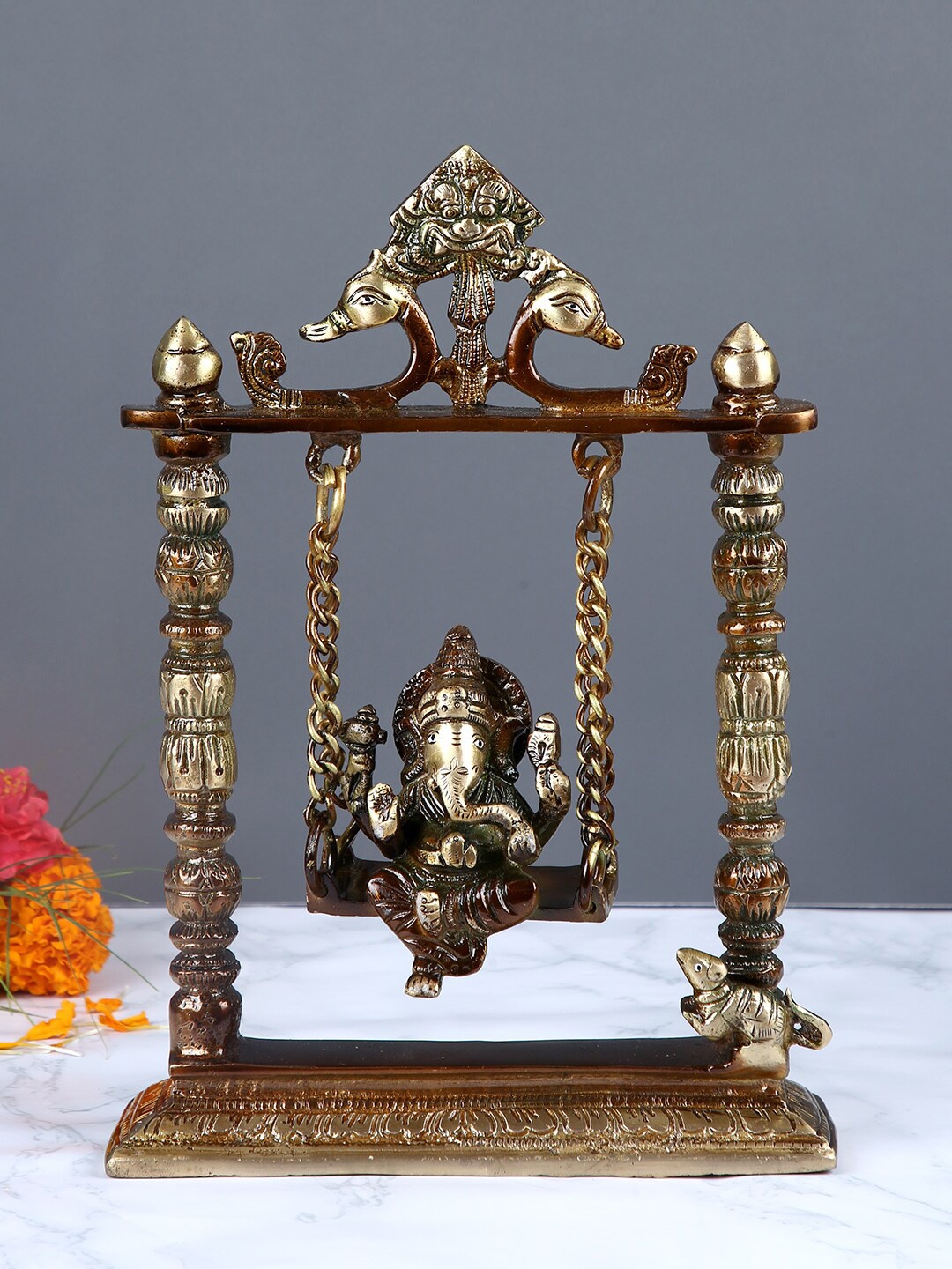 

Aapno Rajasthan Brown & Gold-Toned Handcrafted Ganesha in Jhoola Statue