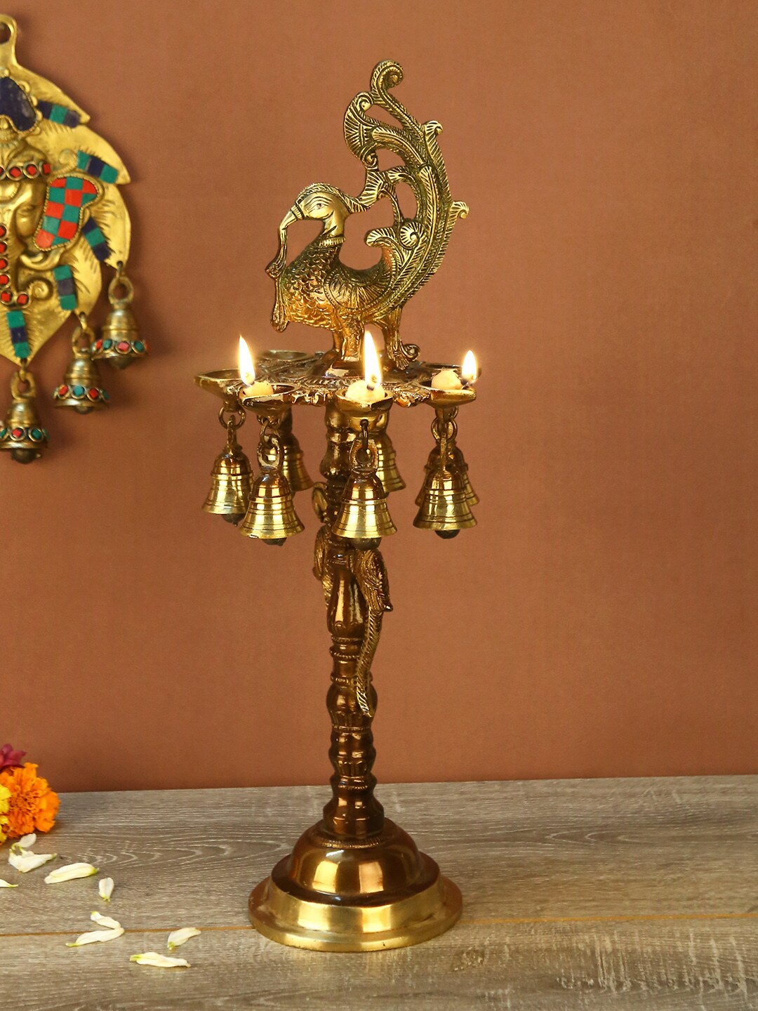 

Aapno Rajasthan Brown & Gold-Toned Brass Peacock Oil Lamp