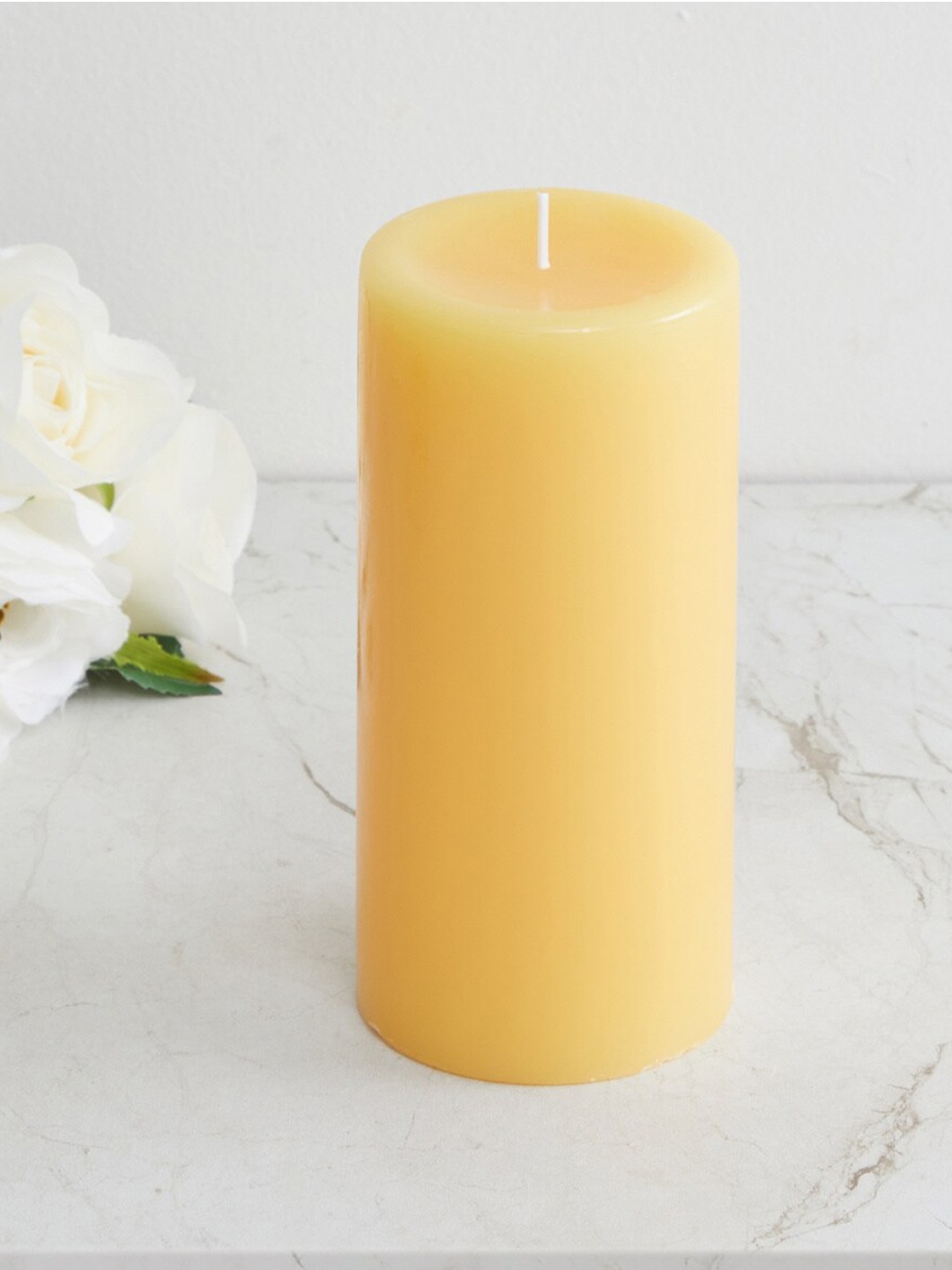 

Home Centre Yellow Soild Lemongrass Pillar Candle