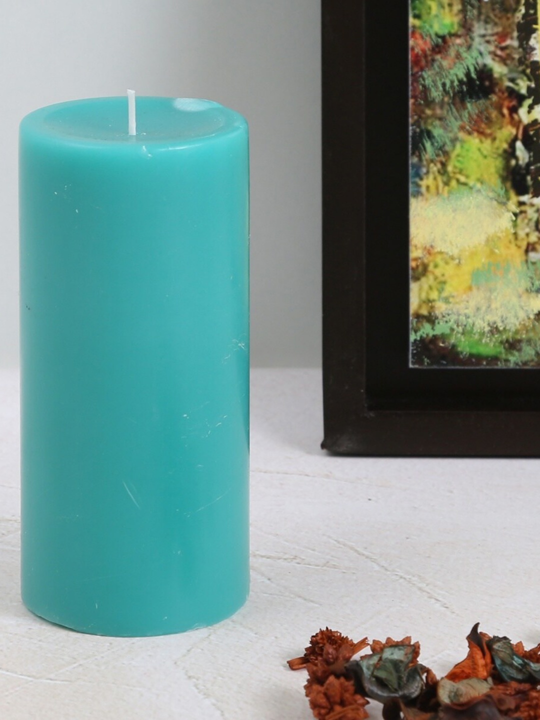 

Home Centre Blue Soild Blueberry Pillar Candle