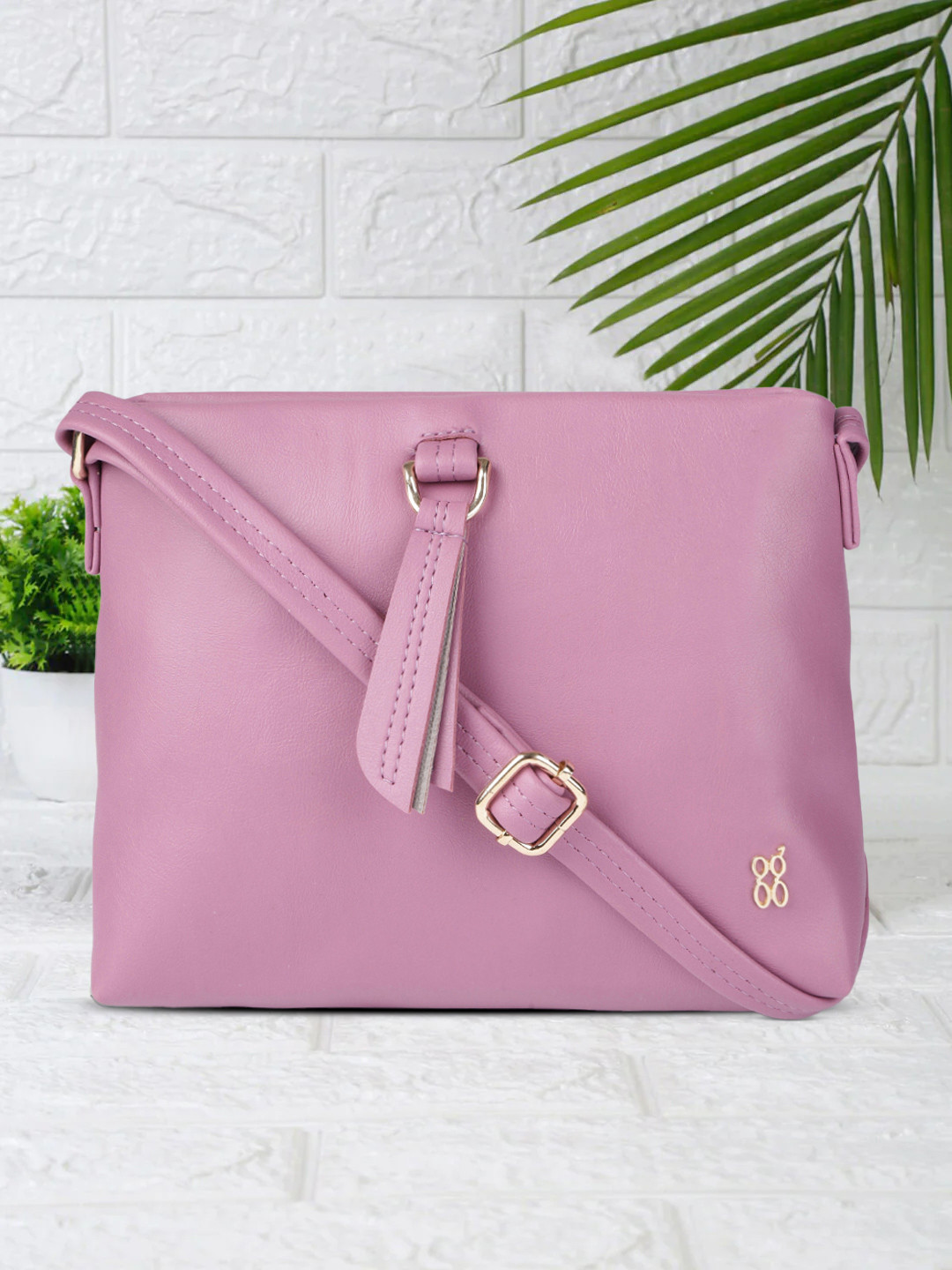 

Baggit Magenta Solid & Tasselled Structured Sling Bag