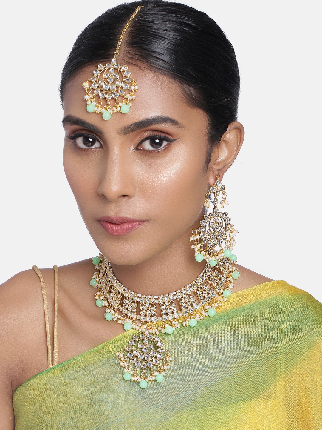 

Peora Gold Plated Sea Green Kundan Studded Handcrafted Enamelled Jewellery Set