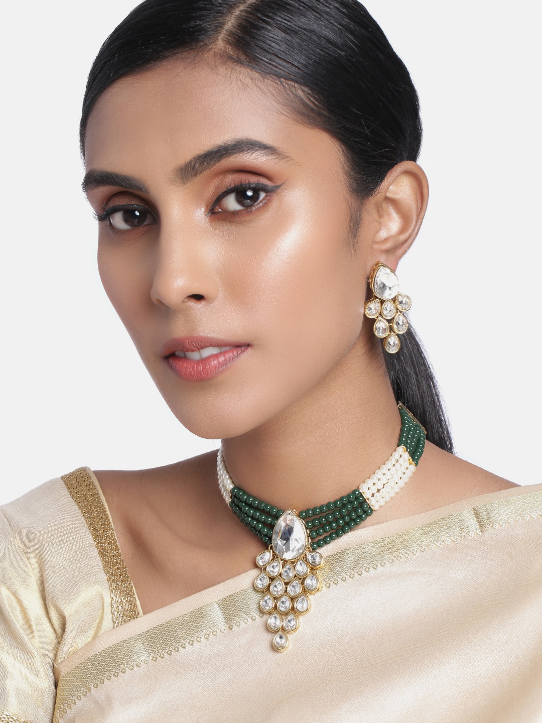 

Peora Gold Plated & Green Crystasl & Pearl Studded Jewellery Set