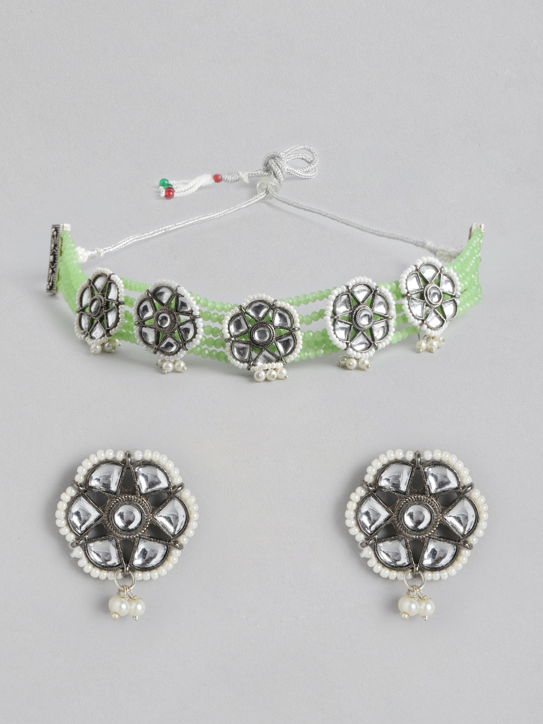 

Melani Borsa Women Oxidised Silver-Toned & Green Kundan Studded & Beaded Jewellery Set