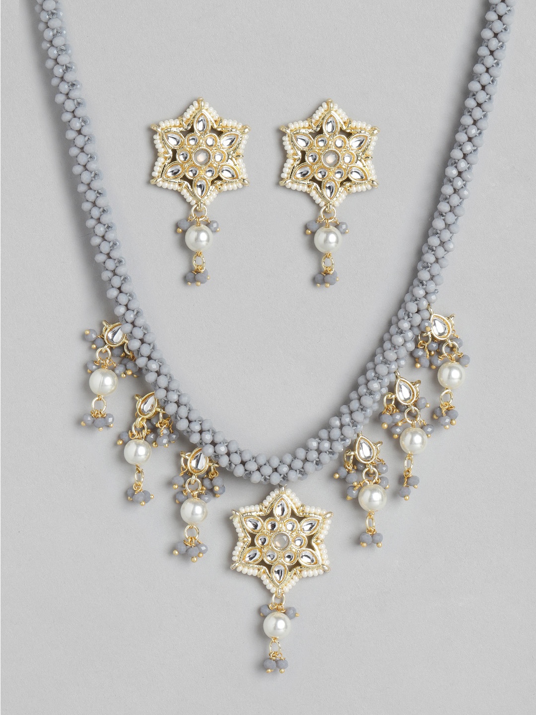 

Melani Borsa Grey Gold-Plated Kundan Studded & Beaded Jewellery Set