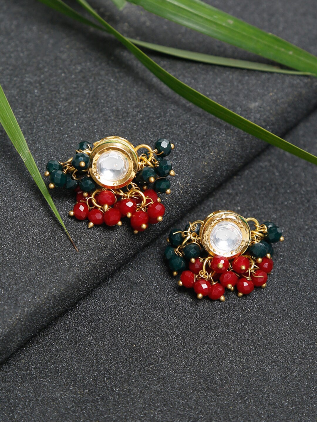 

Ruby Raang Women Gold-Toned Kundan & tasseled Beads Contemporary Studs Earrings