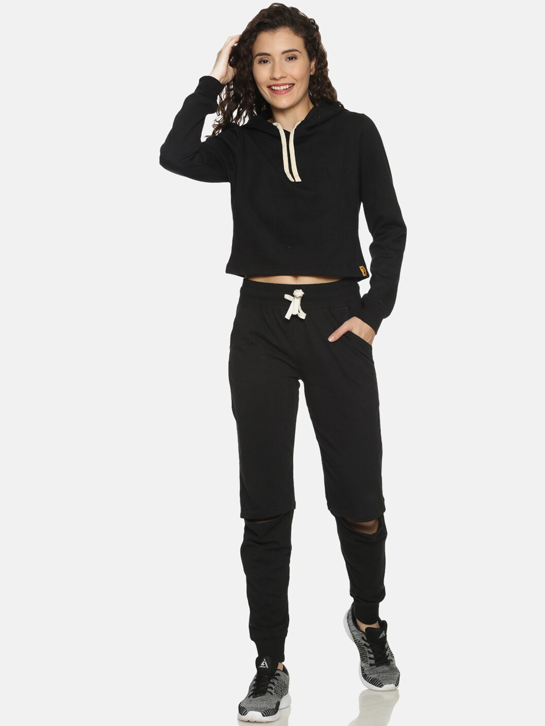 

Campus Sutra Women Black Solid Cotton Tracksuit