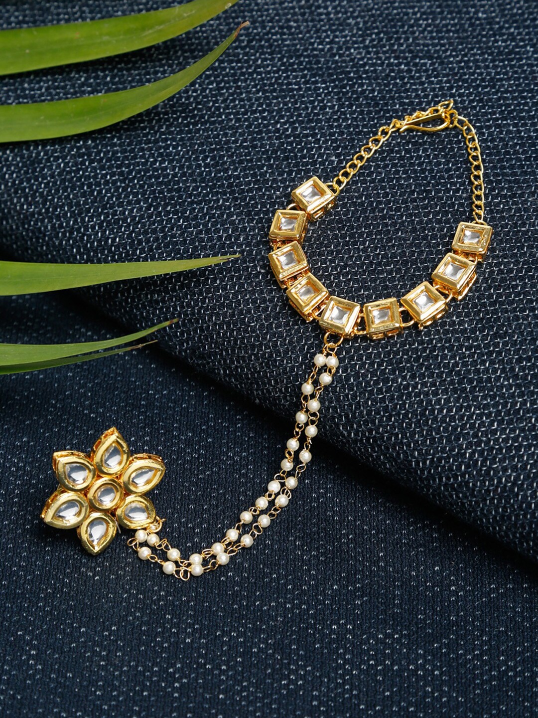 

Ruby Raang Women Gold-Toned & White Kundan Ring Bracelet