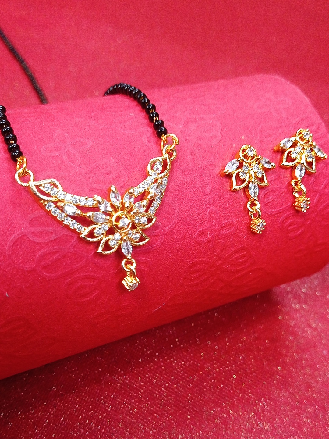 

OOMPH Gold Toned American Diamond Floral Mangalsutra Set