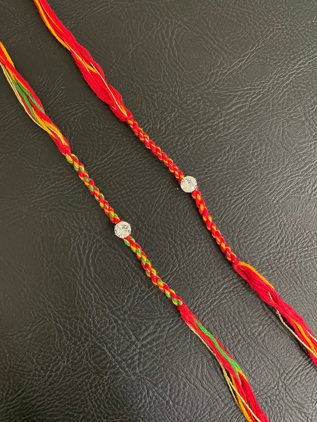 

Digital Dress Room Men Set of 2 Red & Orange Thread Rakhis