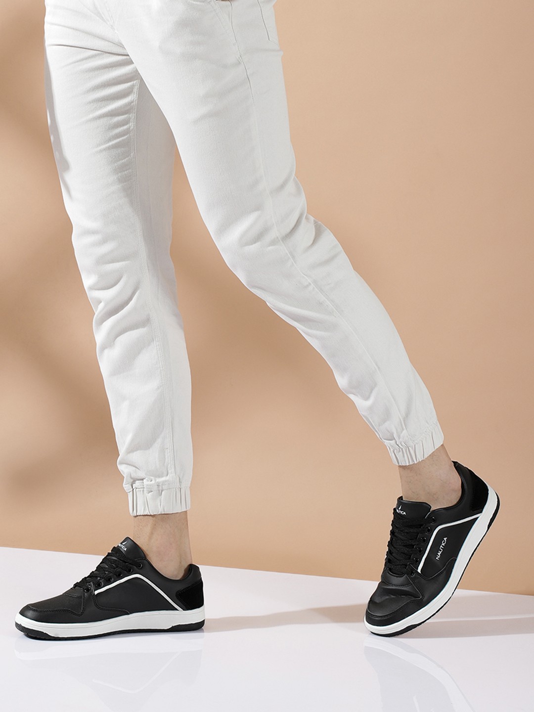 

Nautica Men Black Solid Sneakers with Brand Logo Printed Detail