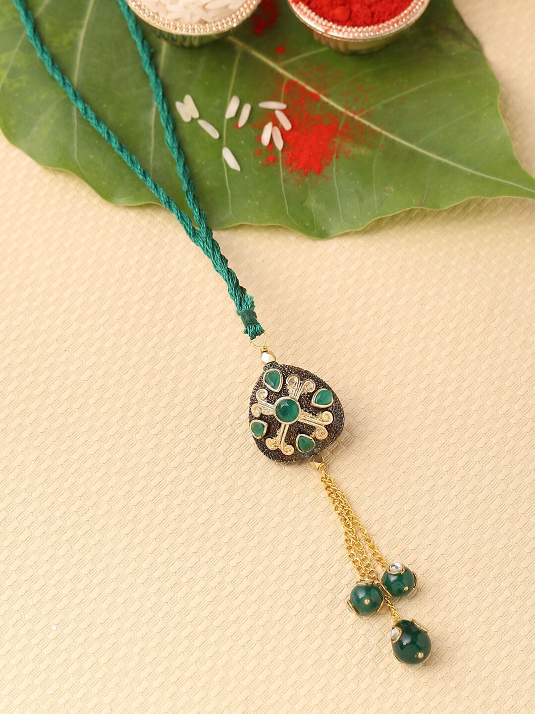 

Tistabene Green & Black Traditional Rakhi