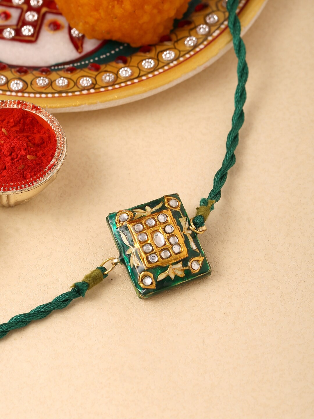 

Tistabene Green & Gold Toned Floral Enamelled Rakhi