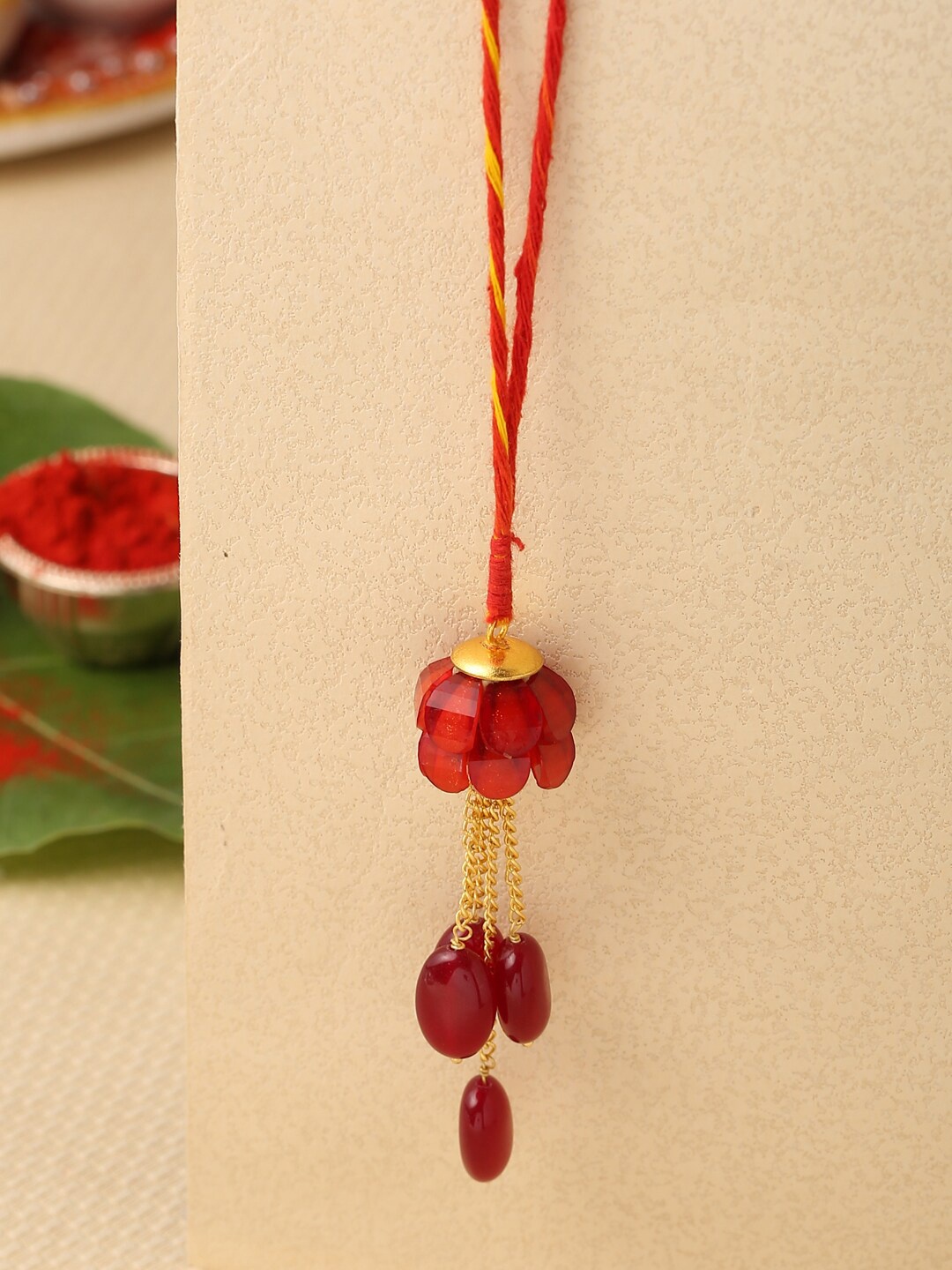 

Tistabene Red & Gold-Toned Contemporary Rakhi