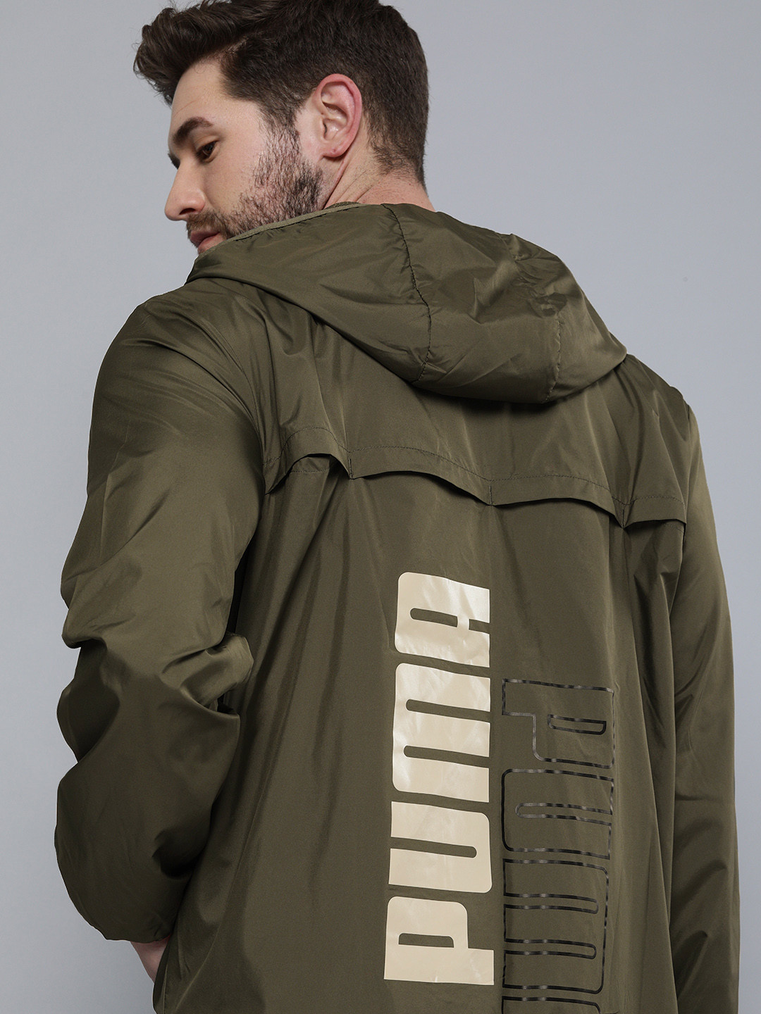 

Puma Men Olive Green Logo Essential Graphic Windbreaker Jacket