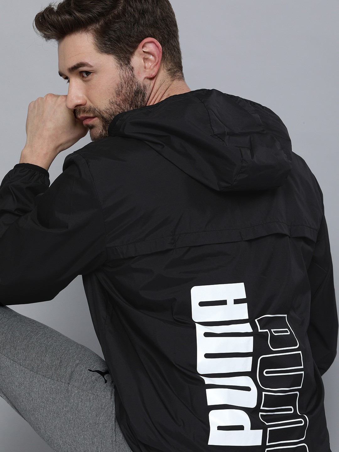

Puma Men Black Logo Essential Graphic Windbreaker Jacket