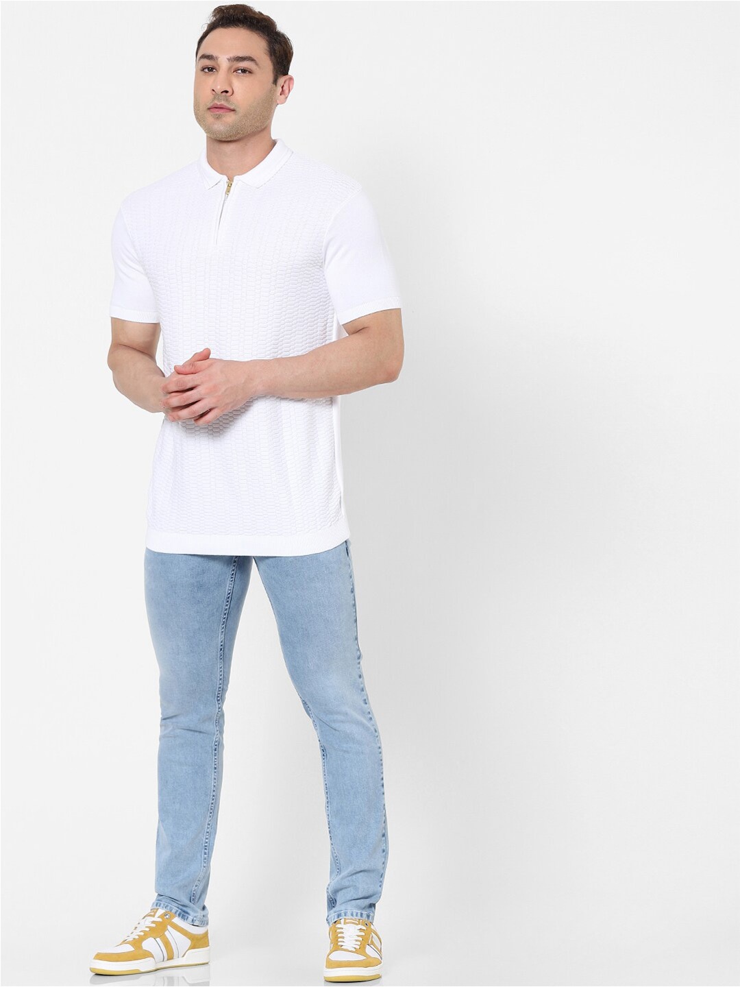 

Celio Men White Self Designed Polo Collar T-shirt