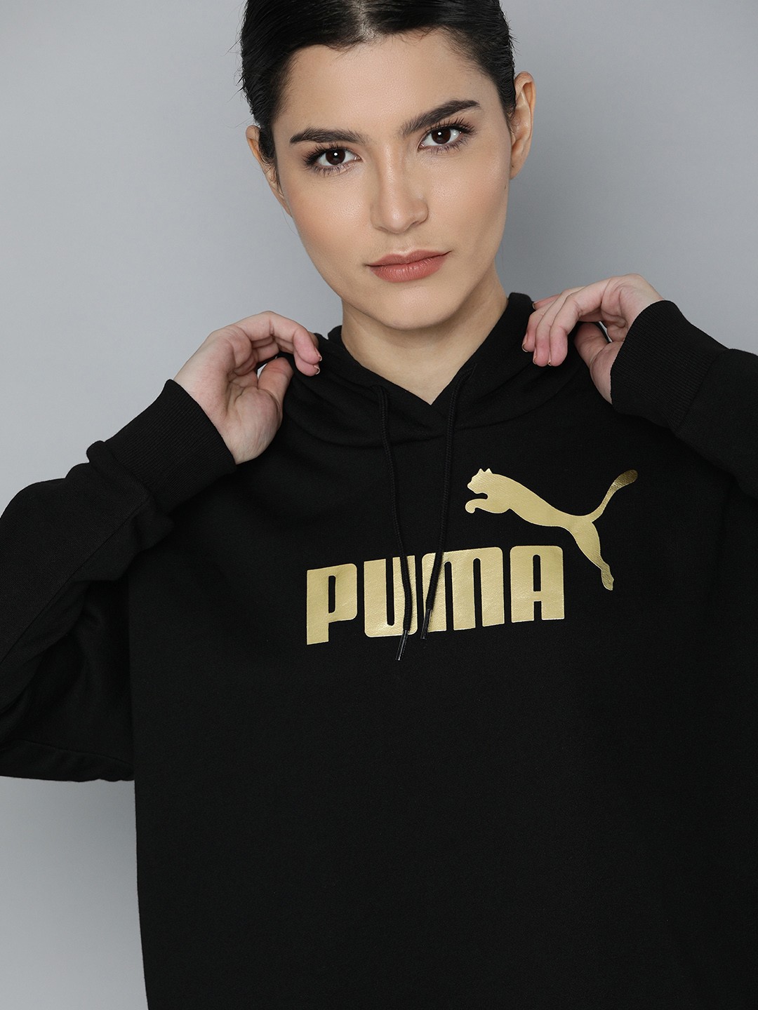 

Puma Women Black & Gold Brand Logo Printed Hooded Sweatshirt
