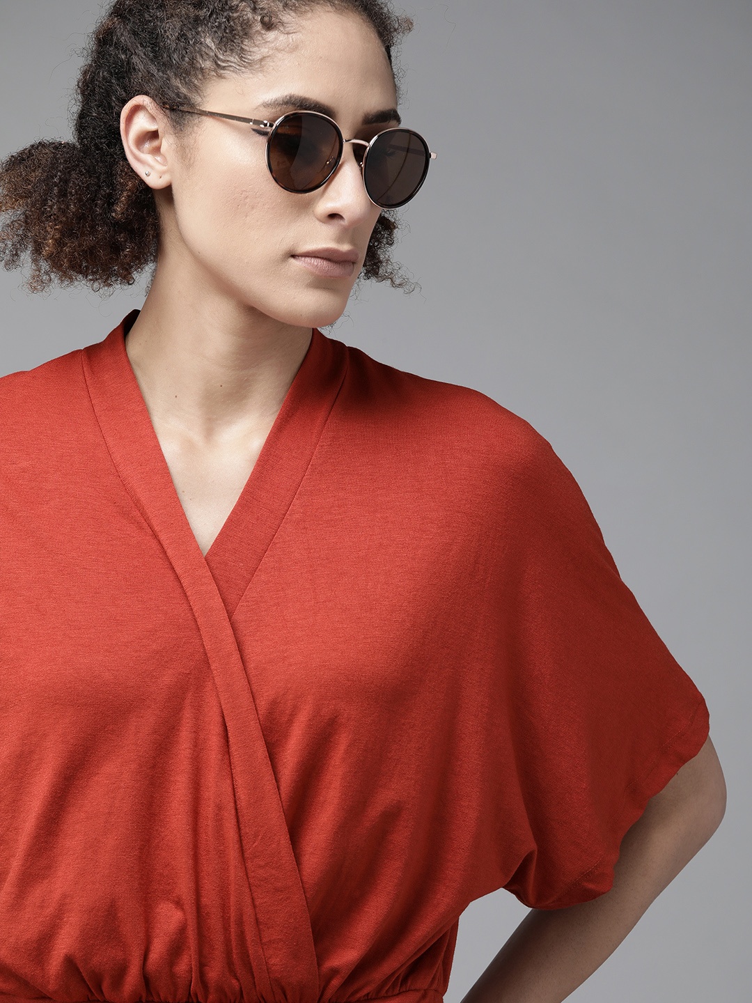 

Roadster Rust Red Solid Extended Sleeves Wrap Blouson Top