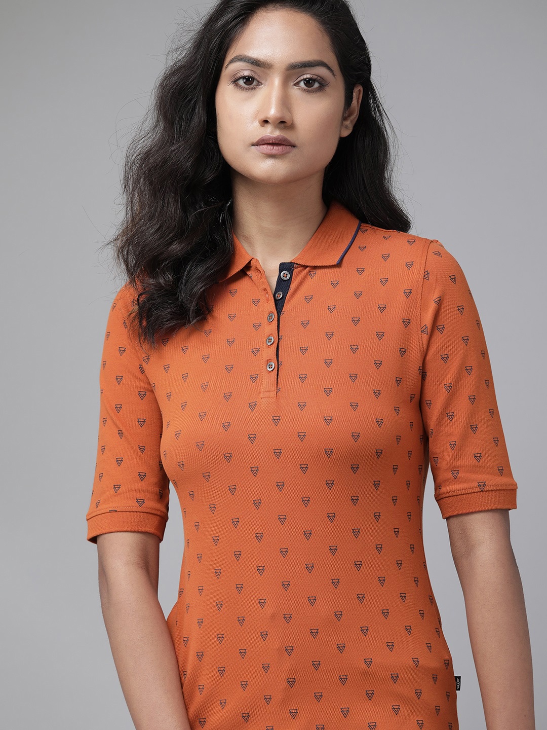 

Roadster Women Rust Orange & Blue Geometric Printed Polo Collar T-shirt