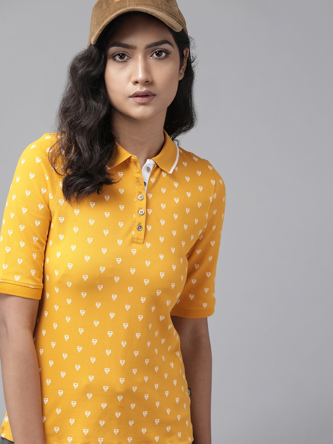 

Roadster Women Mustard Yellow & White Printed Polo Collar T-shirt