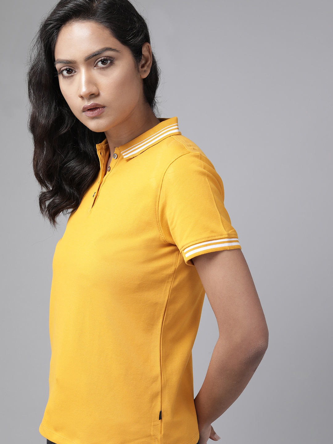 

Roadster Women Yellow Solid Polo Collar T-shirt