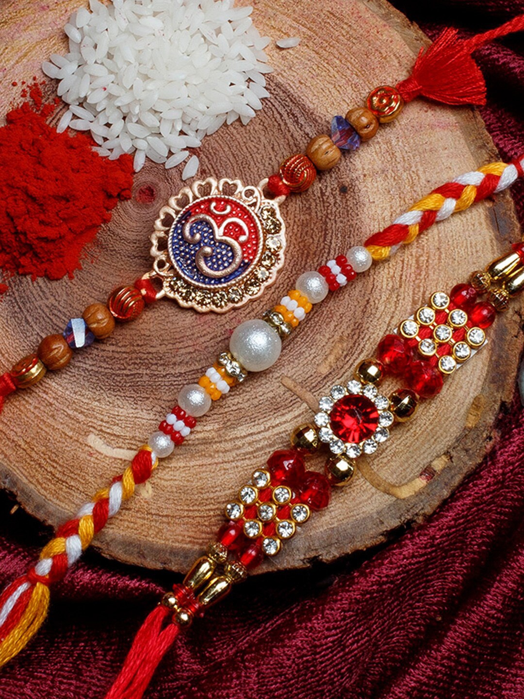 

Shoshaa Set Of 3 Red & Gold-Coloured Thread Rakhi With Roli Chawal