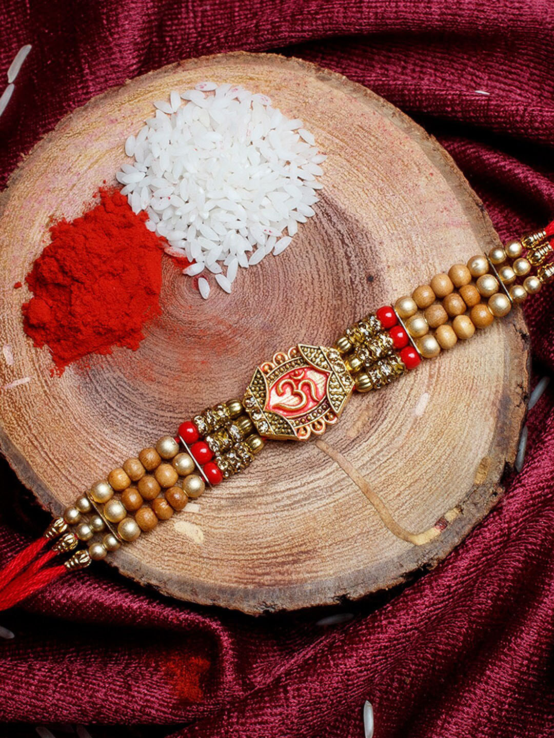 

Shoshaa Gold-Toned & Red Religious Om Thread Single Bhai Rakhi