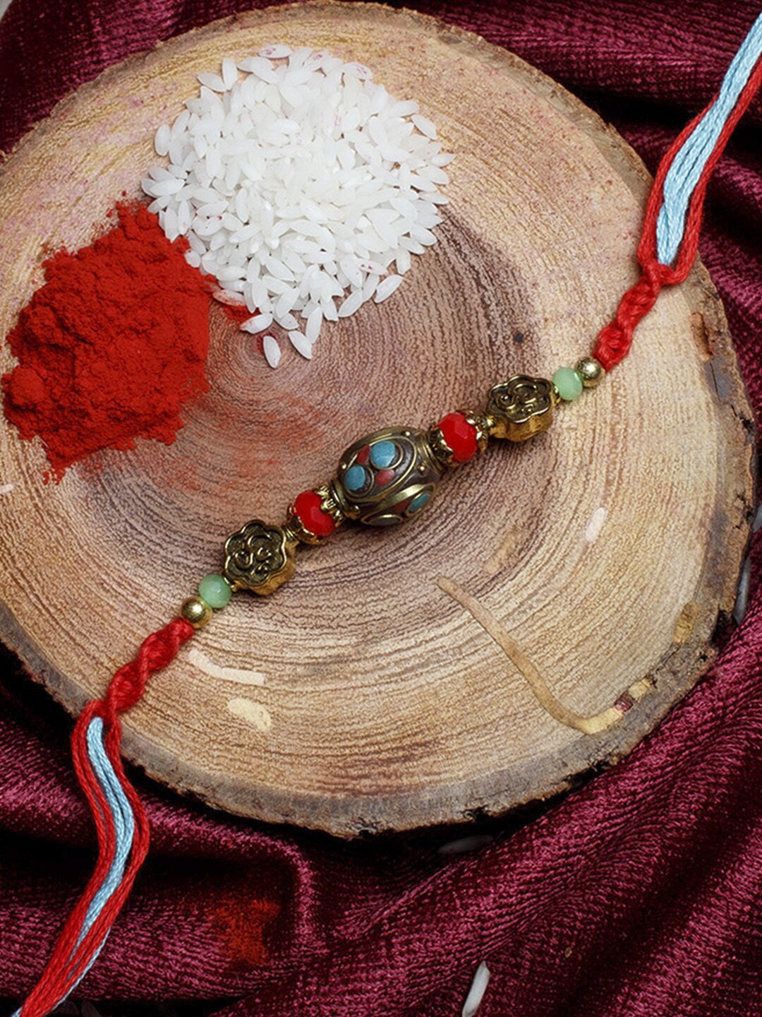 

Shoshaa Multi Color Stone Beaded Red Thread Single Bhai Rakhi