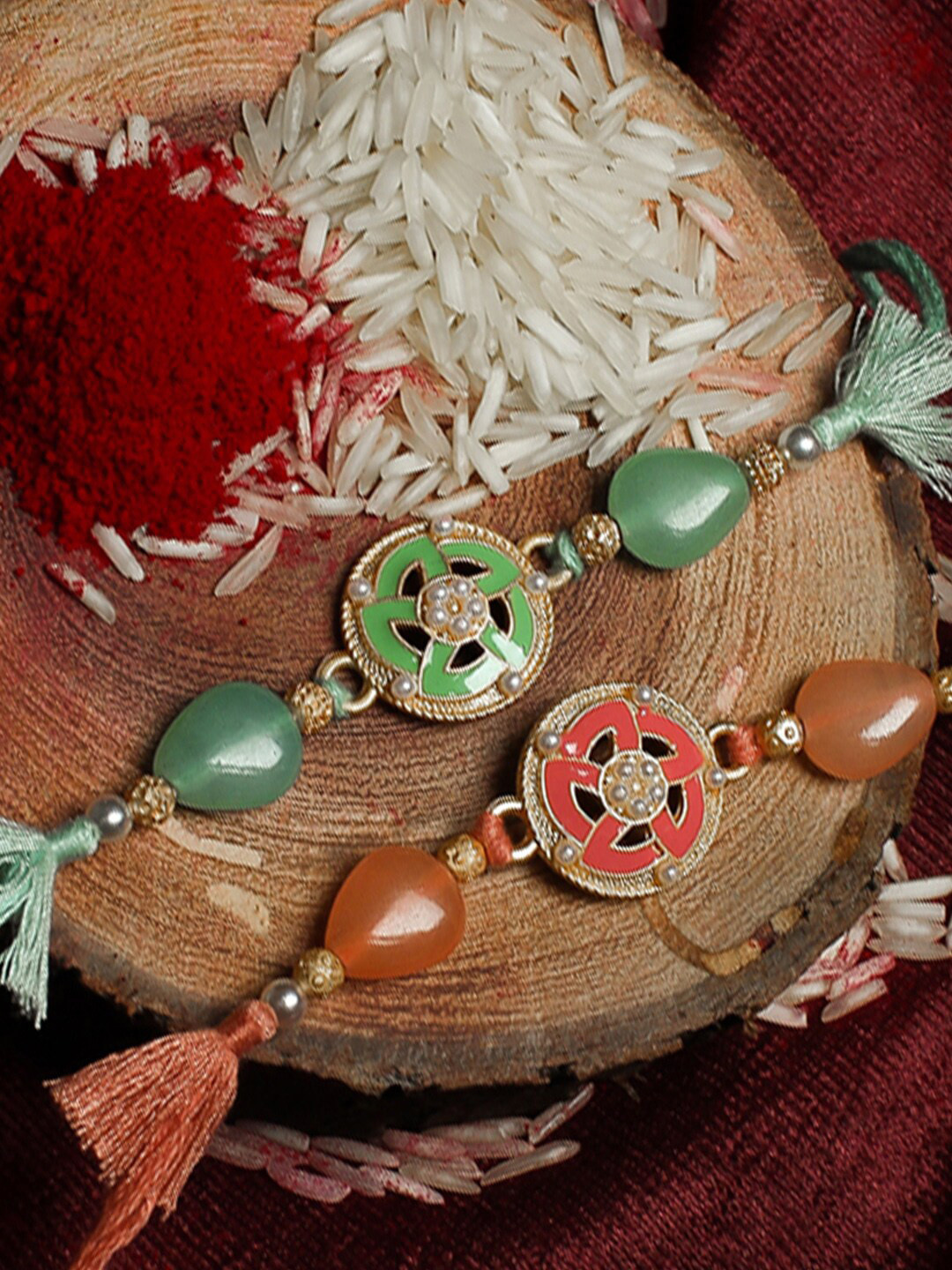 

Shoshaa Set Of 2 Stone-Studded Beaded Green & Peach Thread Combo Bhai Rakhi