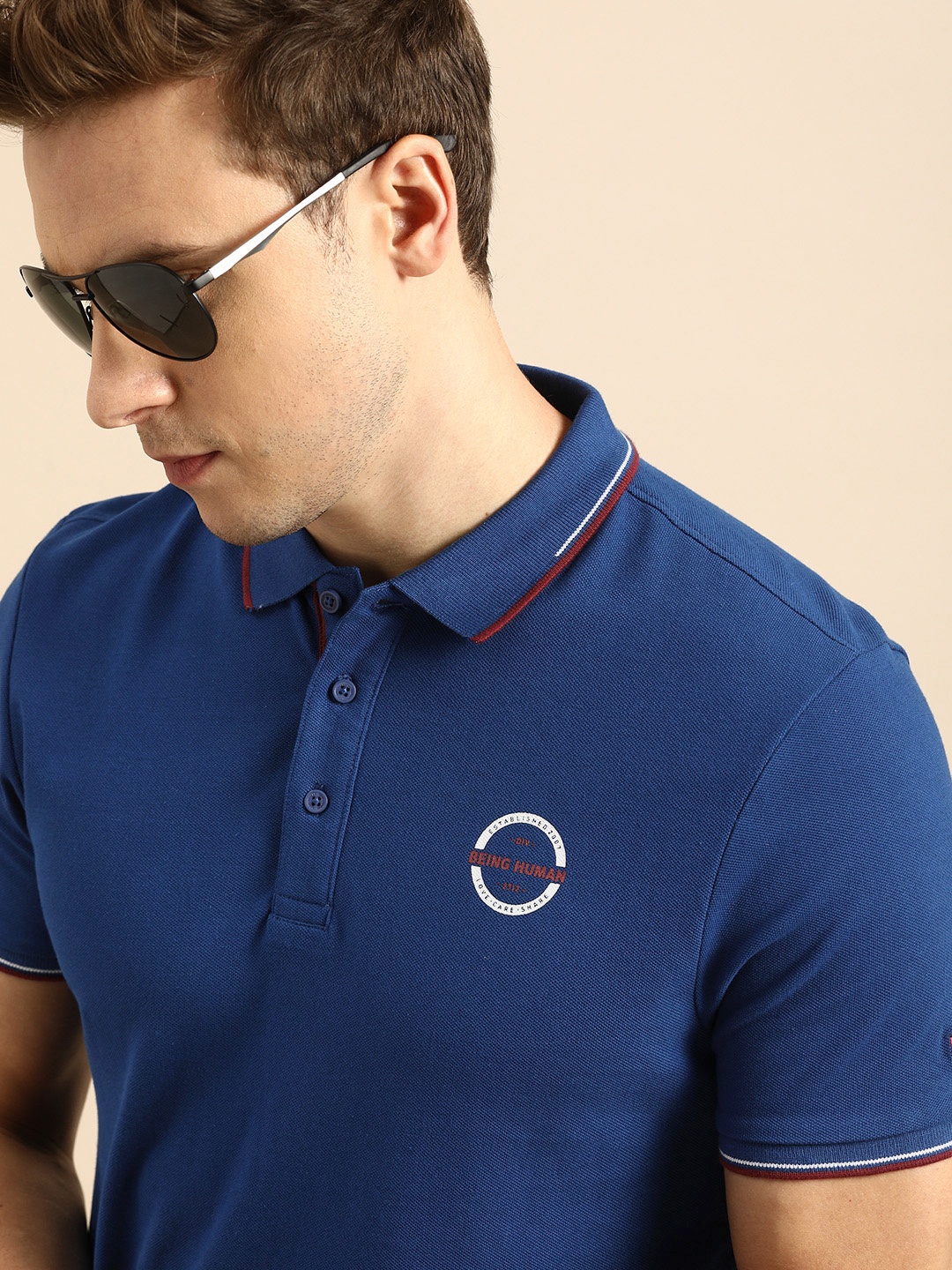 

Being Human Men Blue Solid Polo Collar Pure Cotton T-shirt with Printed Detail
