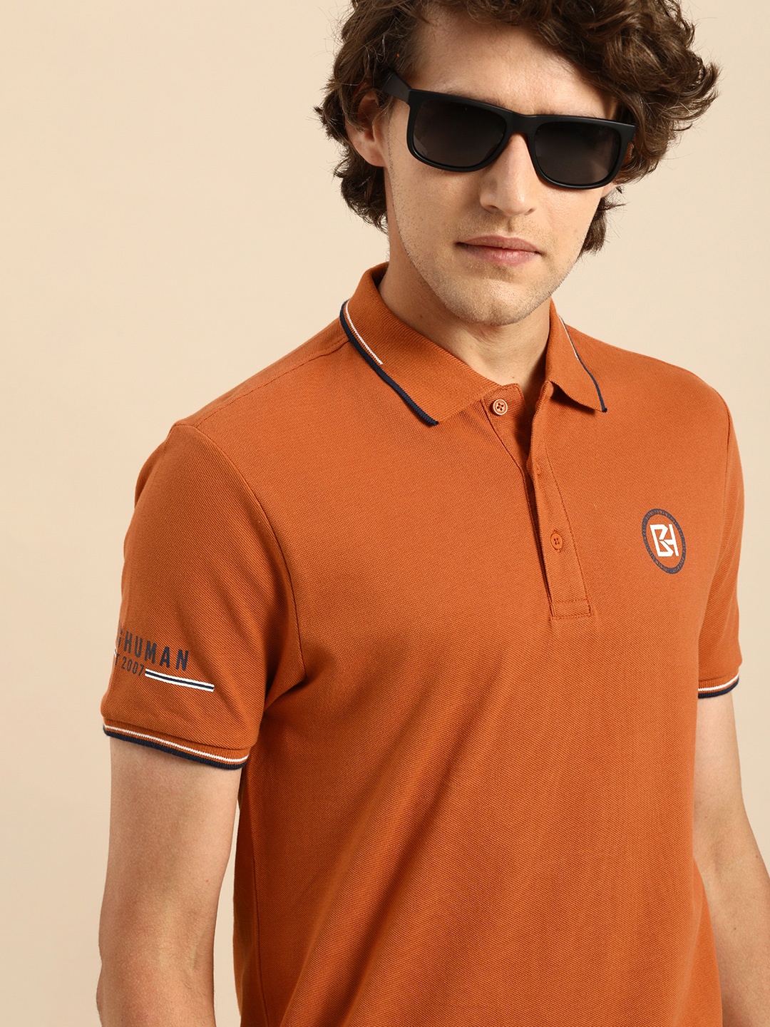 

Being Human Men Rust Orange Solid Polo Collar Pure Cotton T-shirt with Printed Detail