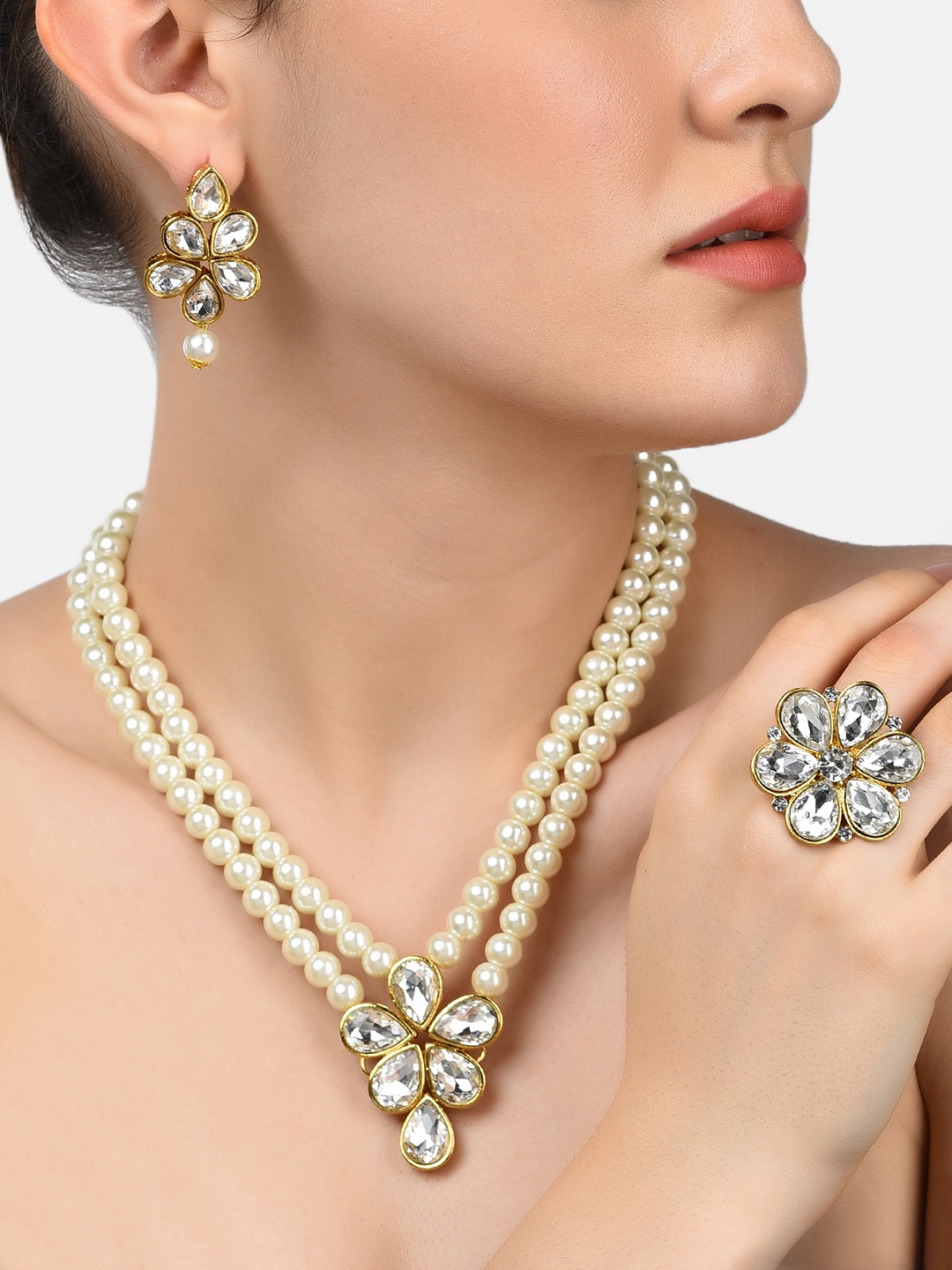

Zaveri Pearls Gold-Plated & White Stone-Studded & Pearl-Beaded Jewellery Set