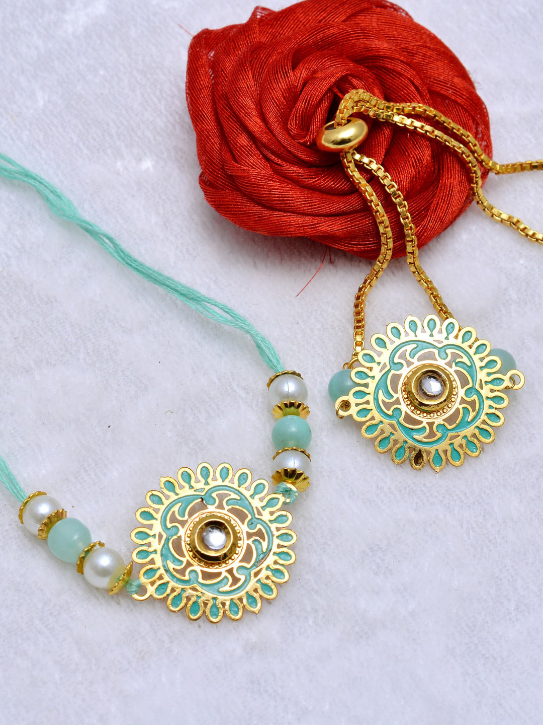 

PANASH Unisex Gold- Toned & Blue Gold Plated Handcrafted Rakhi & Lumba Set