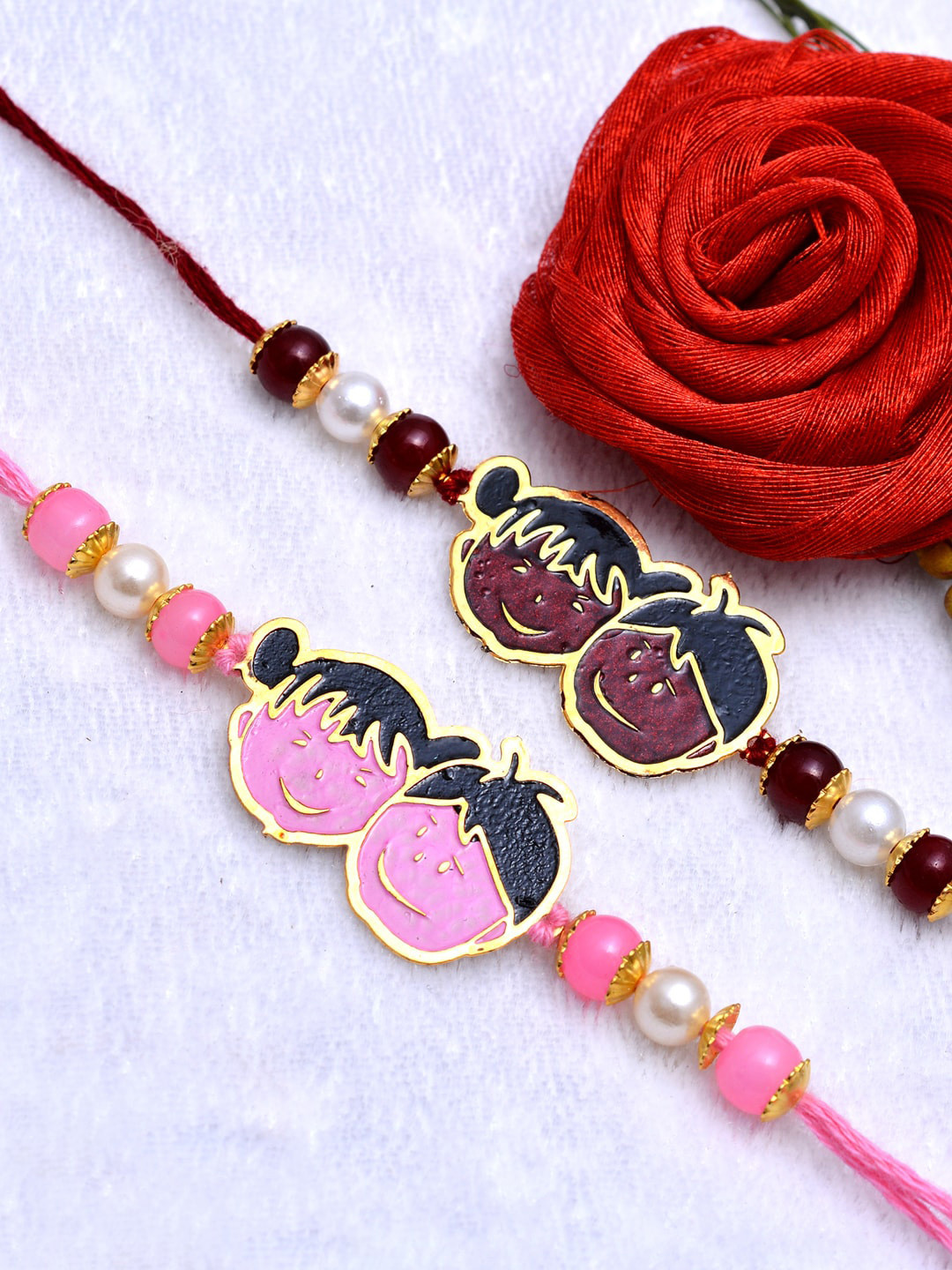 

PANASH Set of 2 Boys Gold-Toned Pink & Red Handcrafted Rakhi With Roli Chawal