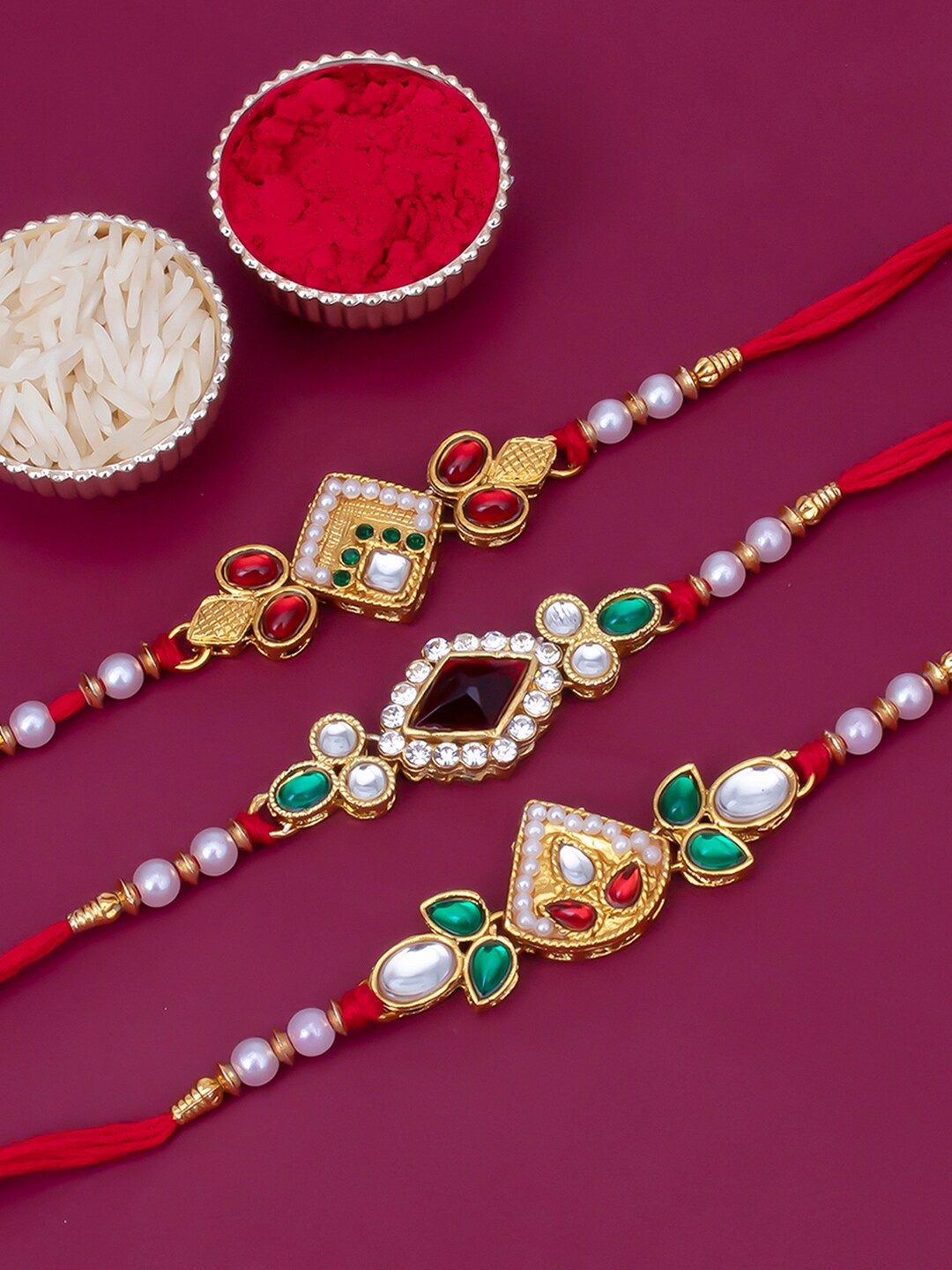 

Sukkhi Rakhi Men Set Of 3 Gold-Plated Red & White Stone-Studded Beaded Rakhi With Roli Chawal & Greeting Card