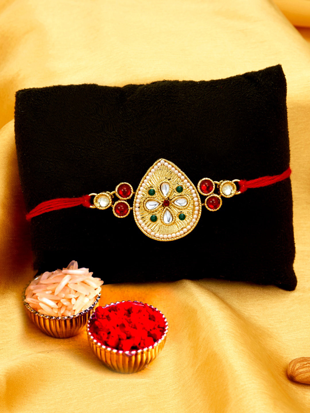 

Sukkhi Rakhi Men Gold-Plated Red & White Stone-Studded Rakhi With Roli Chawal & Greeting Card
