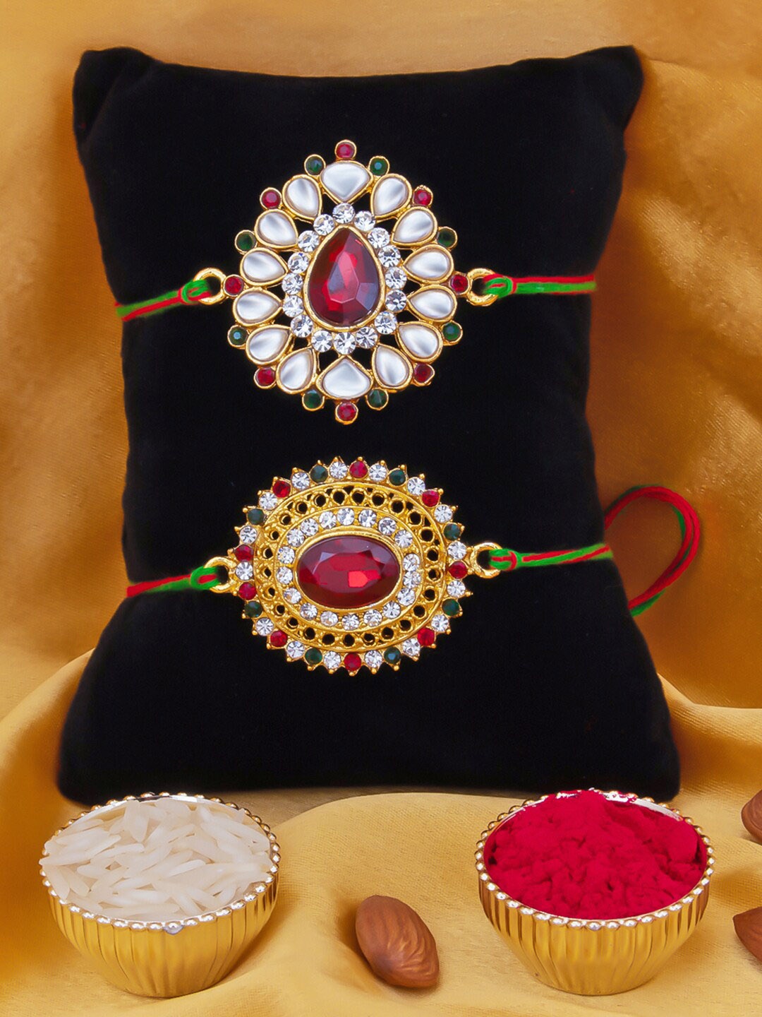 

Sukkhi Rakhi Men Set Of 2 Gold-Plated White & Red Stone-Studded Rakhi With Roli Chawal & Greeting Card