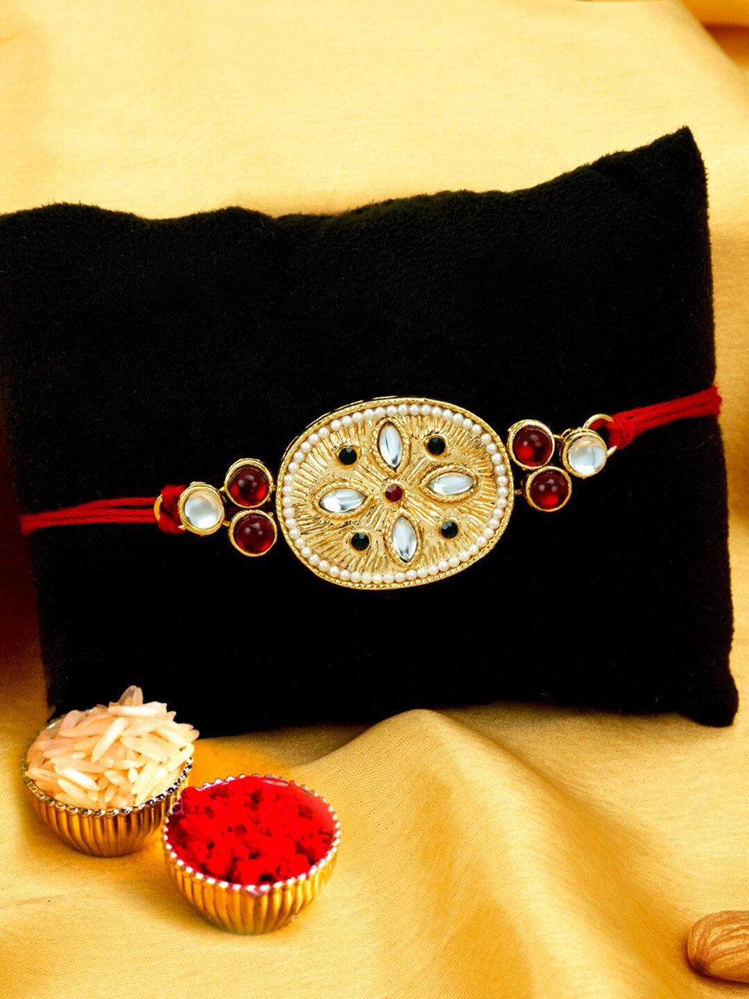 

Sukkhi Rakhi Men Gold-Toned White & Red Rakhi With Roli Chawal & Greeting Card
