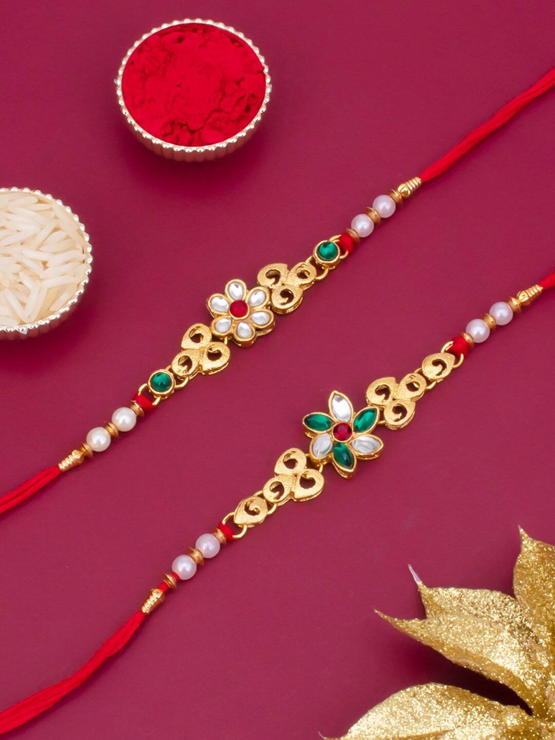 

Sukkhi Rakhi Men Set Of 2 Gold-Toned & Red Thread Rakhi With Roli Chawal & Greeting Card