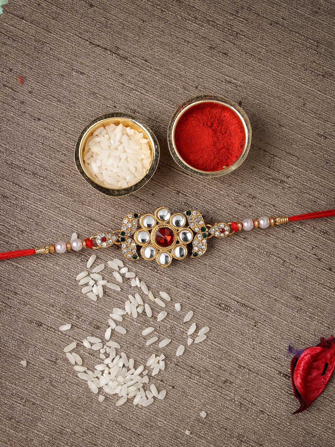 

Sukkhi Rakhi Men Gold-Plated White & Red Stone-Studded & White Beaded Rakhi With Roli Chawal & Greeting Card