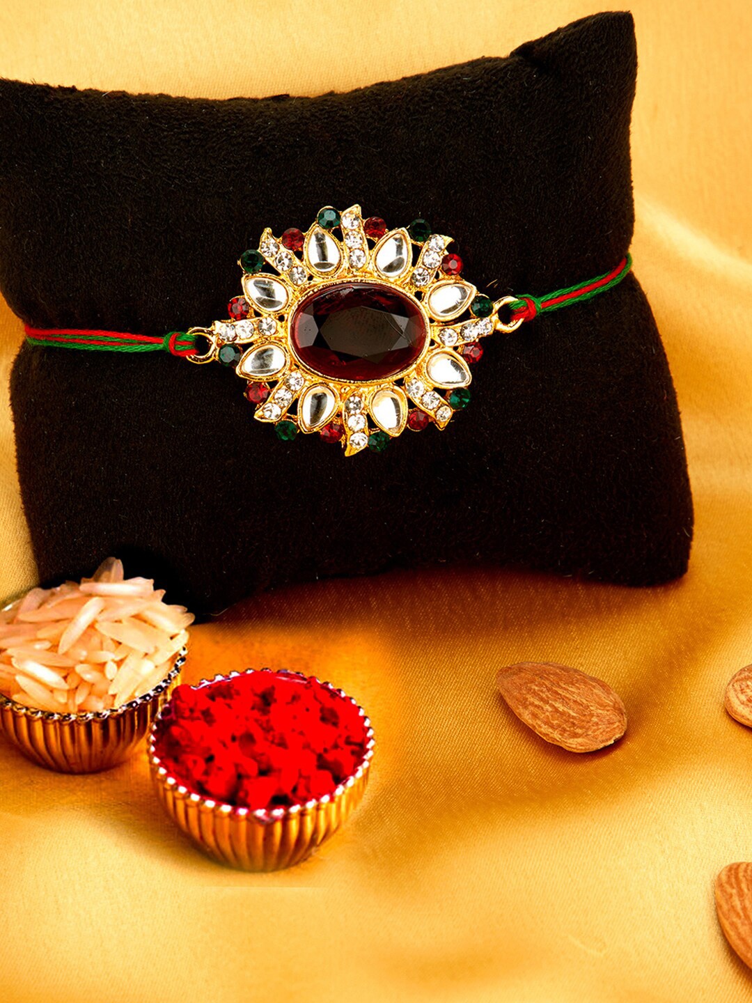 

Sukkhi Rakhi Men Gold-Plated Red & White Stone-Studded Rakhi With Roli Chawal & Greeting Card