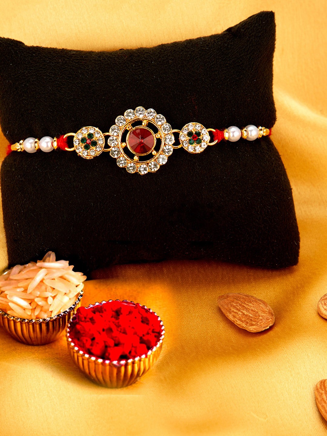 

Sukkhi Rakhi Men Gold-Plated Red & White Stone-Studded Rakhi With Roli Chawal & Greeting Card