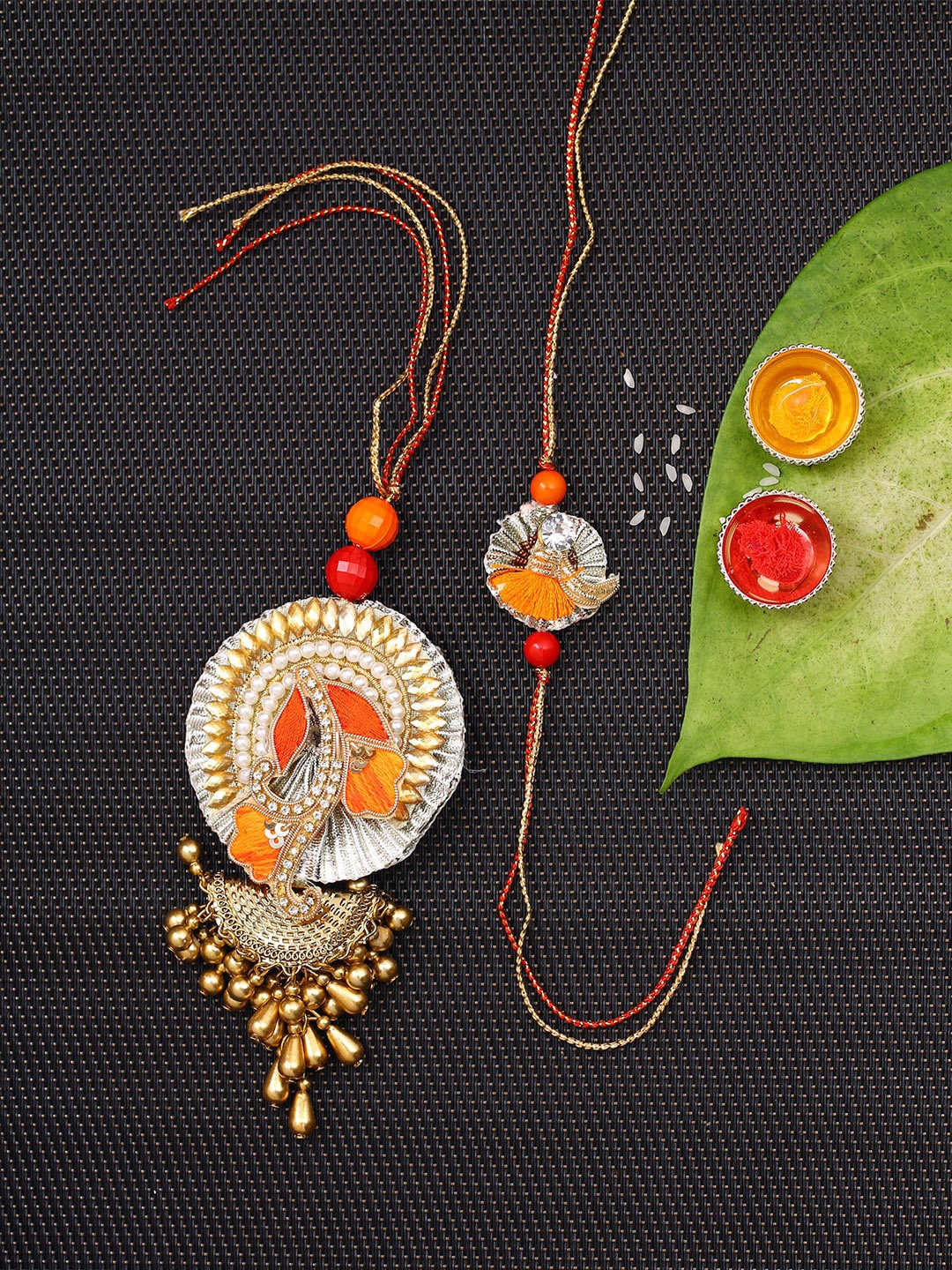 

Aapno Rajasthan Unisex Set Of 2 Orange & Gold-Toned Stone Studded Beaded Traditional Bhaiya Bhabhi Rakhis