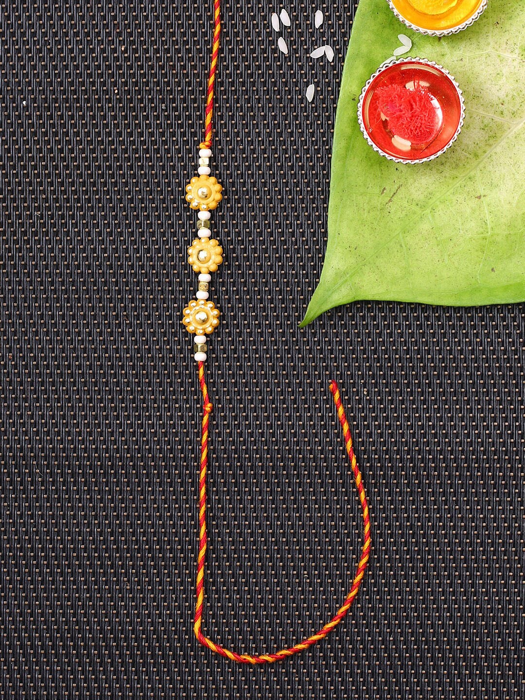 

Aapno Rajasthan Yellow Flower Design Mauli Rakhi
