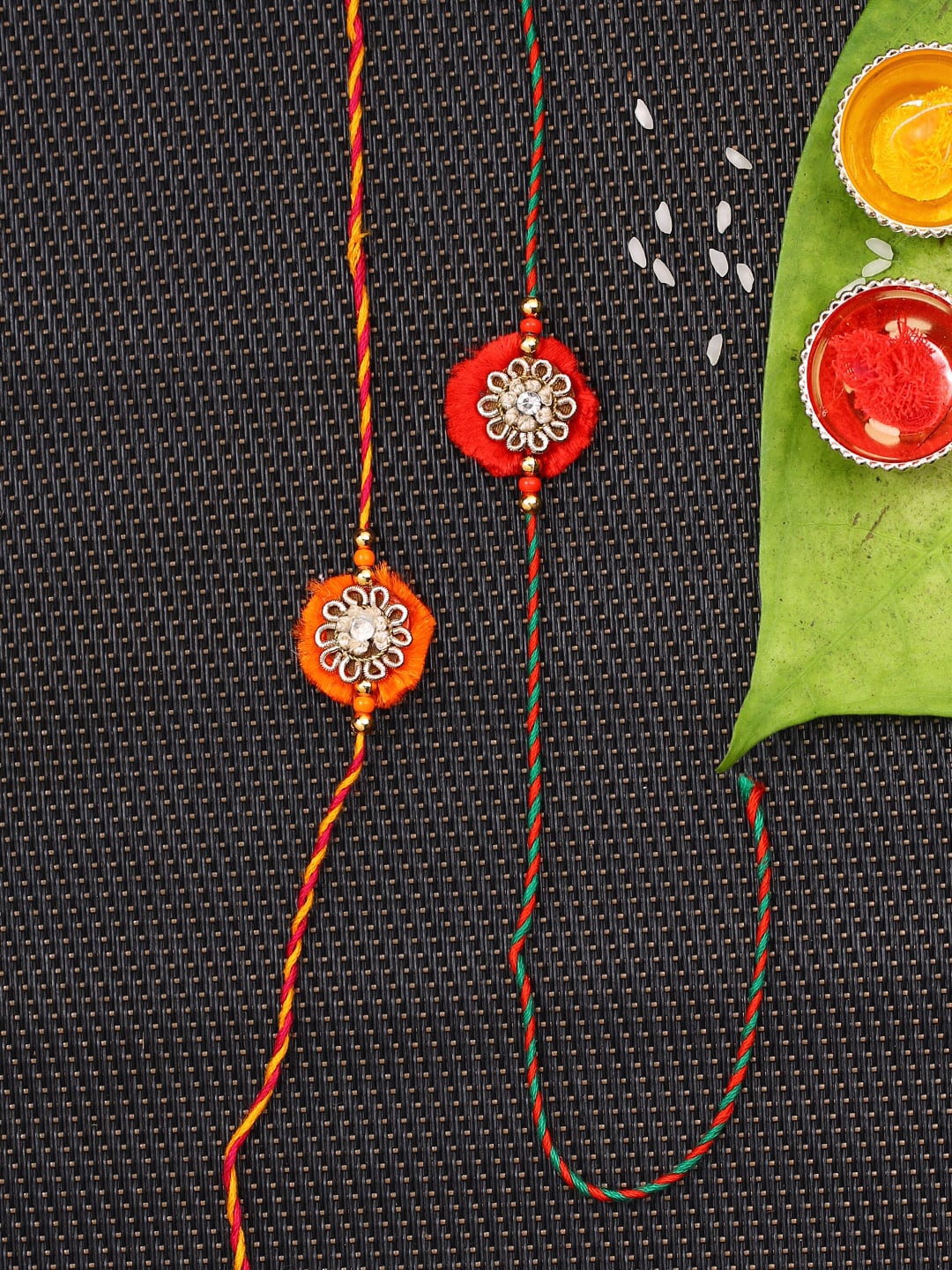 

Aapno Rajasthan Red & Orange Set of 2 Traditional Flower Design Rakhi